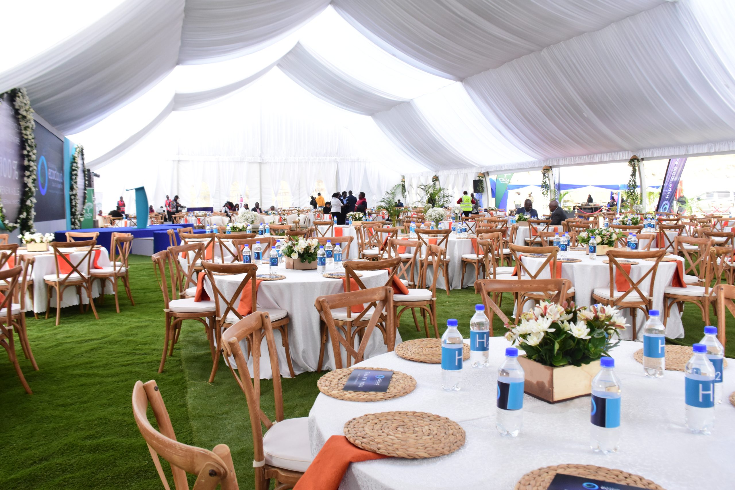 a large tent with tables and chairs